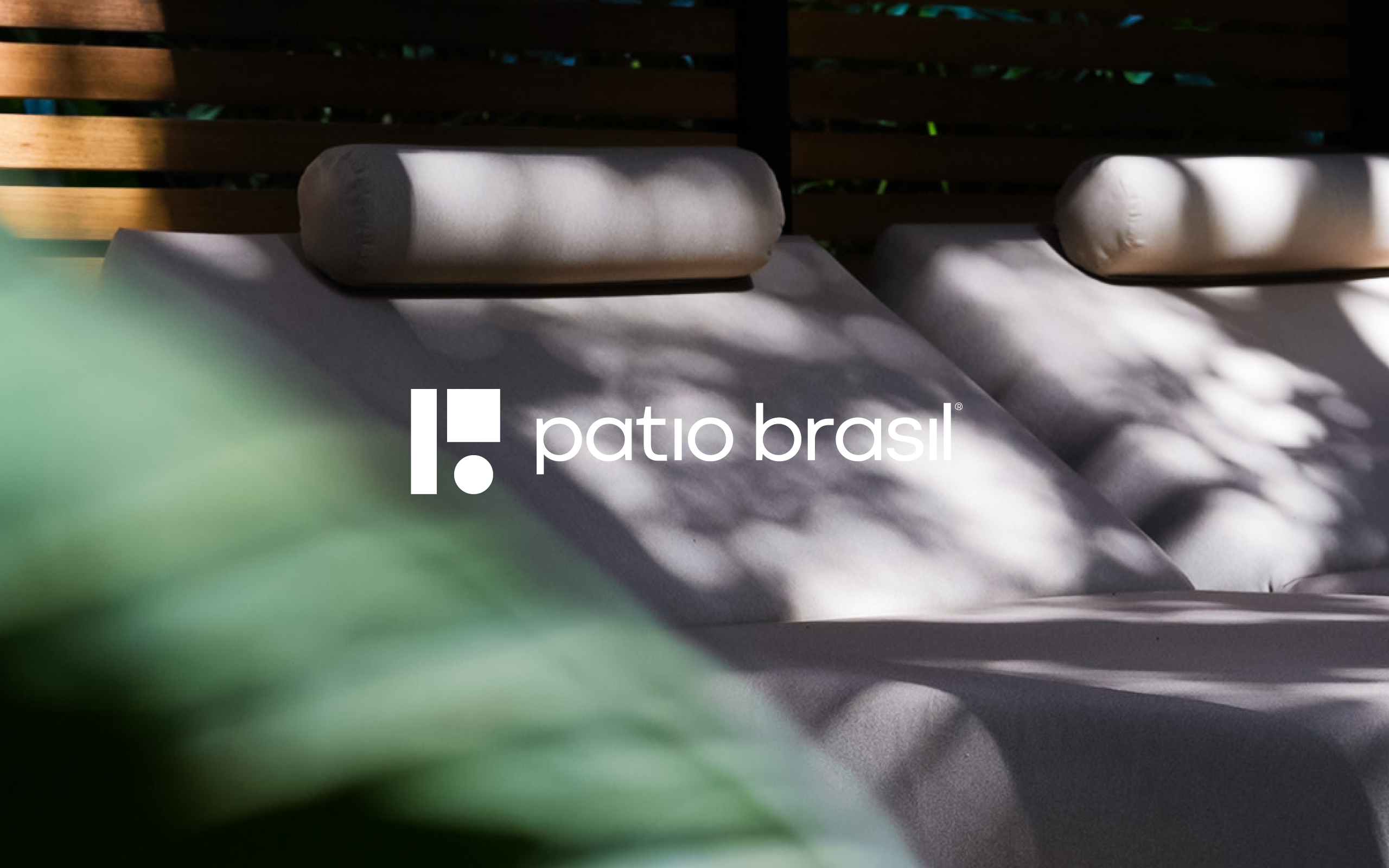 White Patio Brasil logo applied over a photograph of upholstered lounge chairs in an outdoor setting. The composition directly connects the brand identity with outdoor furniture, comfort, nature and contemporary design.