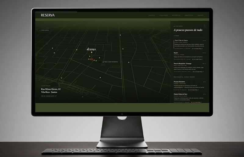 Second view of the Reserva Vila Rica interactive map, showing the development in relation to the Santos urban grid, Tênis Clube and key destinations in the surrounding area. The interface combines geographic navigation with editorial content.